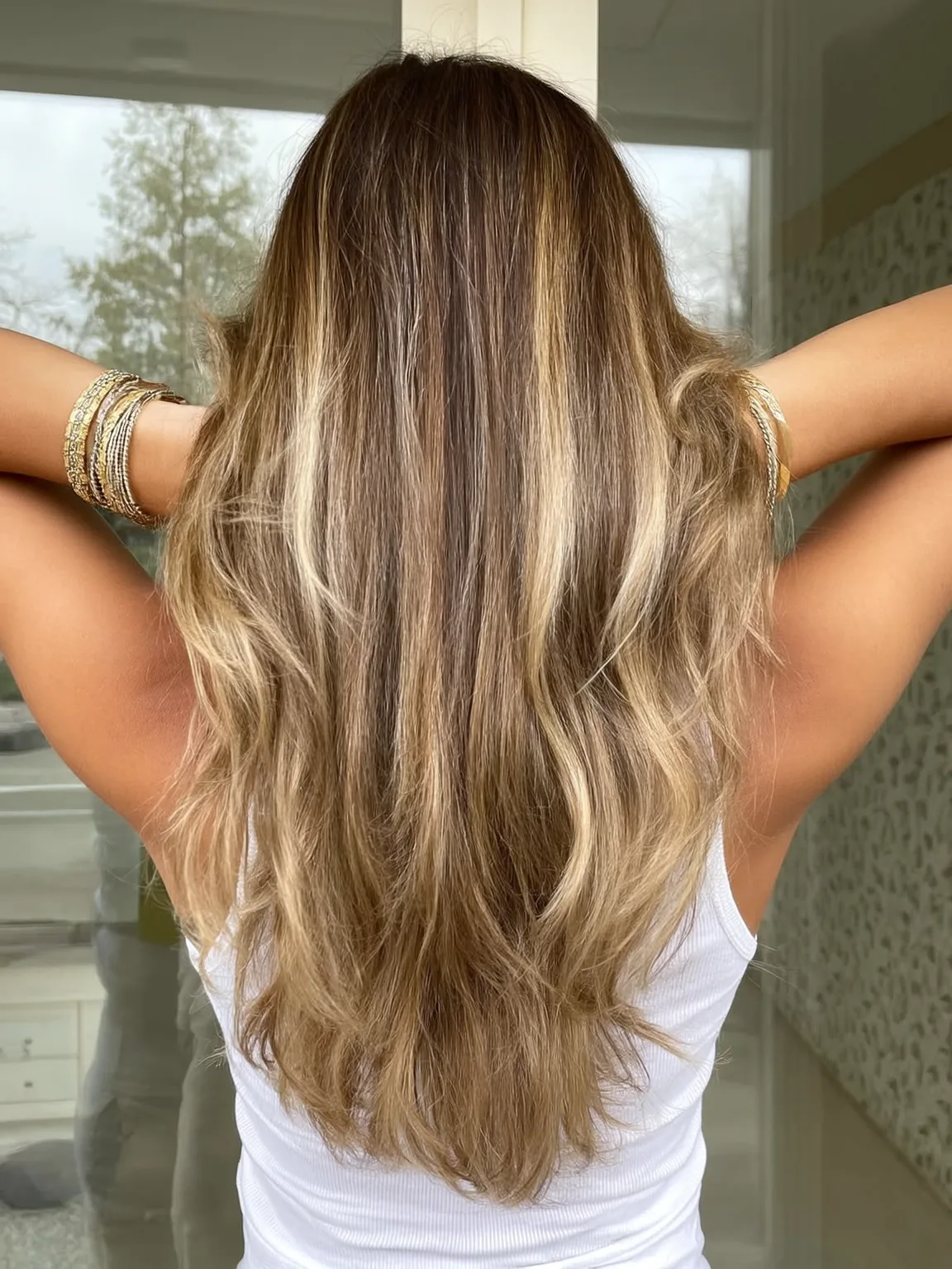 Medium Sandy Blonde Long Layers with Caramel Balayage